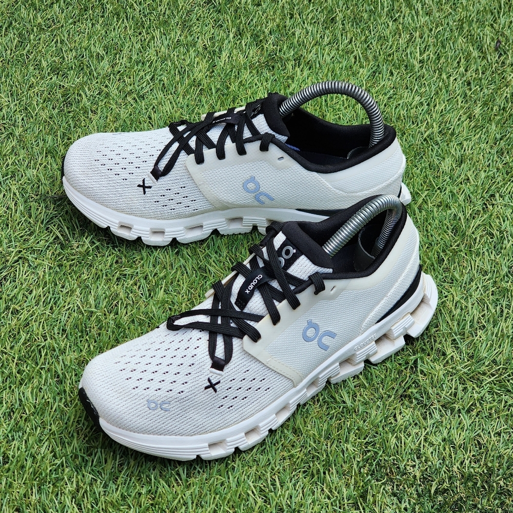On Running White and Black Athletic Shoes